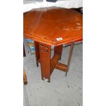 A mahogany octagonal table.