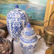 A large blue and white ginger jar and one other.