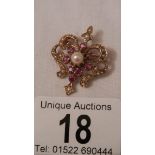 A good old 9ct gold ruby and pearl brooch.