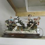 A porcelain figure group of children at play, plaque reads Porcelain Princippe 'I Minelli'.