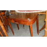 A mahogany fold over tea table.