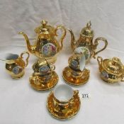 A gold decorated Czeckoslovakian coffee set (missing one cup).