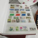2 albums of assorted stamps.