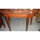 A mahogany fold over table.