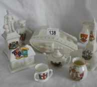 10 pieces of crested china including large tank, statue of Sir Francis Drake etc.