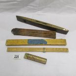 A slide rule for textile calculation, 2 other slide rules and a spirit level.