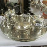 A silver plate 4 piece tea set, tray and gravy boat.