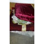 A quantity of old quilts, eiderdowns etc.
