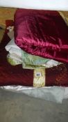 A quantity of old quilts, eiderdowns etc.