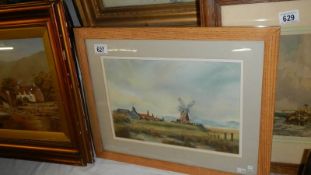 A framed and glazed watercolour with windmill.