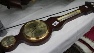 A barometer/thermometer.