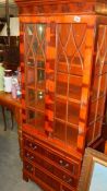An astragal glazed cabinet.