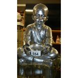 A silver coloured Buddha,