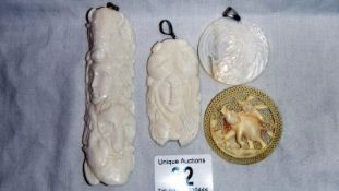 4 interesting bone and mother of pearl pendants etc., depicting animals and female figures.