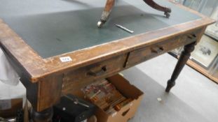 a 3 drawer library table with leather inset top.