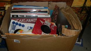 A box of LP and 45 rpm records.