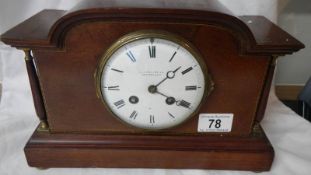 A mahogany inlaid mantel clock with good French movement, complete with key and pendulum,