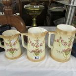 A set of 3 Crown Devon graduated jugs.