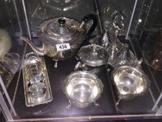 A silver plate tea set, toast rack etc.