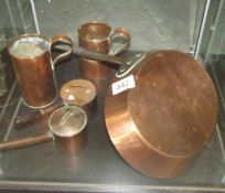 A quantity of copper pans.