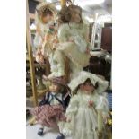 4 porcelain dolls.