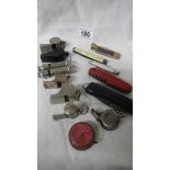 A mixed lot of pen knives, old whistles, tape measure etc.