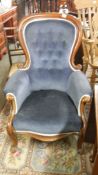 A mahogany framed gentleman's chair with blue upholstery,