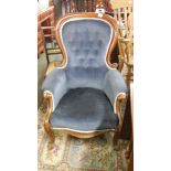 A mahogany framed gentleman's chair with blue upholstery,
