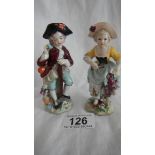 A pair of continental porcelain figures, 4.5" tall, in good condition.