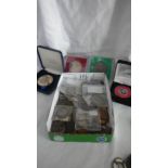 A mixed lot of old coins including some silver.