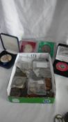 A mixed lot of old coins including some silver.