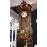 A Victorian mahogany twin weight Vienna wall clock.