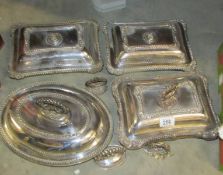 4 silver plated tureens some with odd top handles.