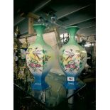 A pair of bird decorated vases.