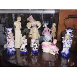 A pair of small Staffordshire cats and a pair of figural spill vases etc.