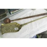 A brass shovel and a copper straining ladle.