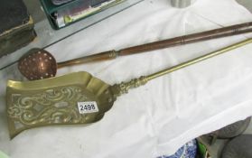 A brass shovel and a copper straining ladle.