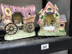 A pottery musical cottage possibly displaying characters from Alice Through the Looking Glass and a