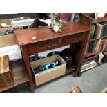 A dark wood stained hall table