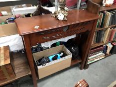 A dark wood stained hall table