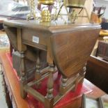 A small oak drop leaf table.