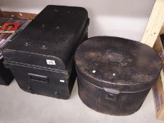 A hat storage tin and 1 other storage tin