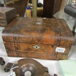 A Victorian walnut and inlaid writing box.