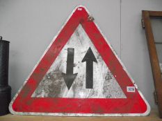 A two way street warning triangle road sign