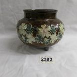 A 3 footed Doulton Lambeth bowl with floral pattern.
