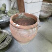 A large terracotta planter.