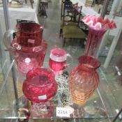 2 large cranberry glass vases, a cranberry glass jug and 2 other cranberry glass items.