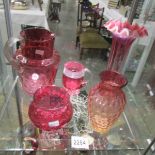 2 large cranberry glass vases, a cranberry glass jug and 2 other cranberry glass items.