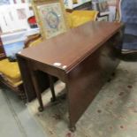 A mahogany drop leaf table.