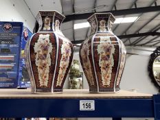 A pair of Italian vases depicting birds